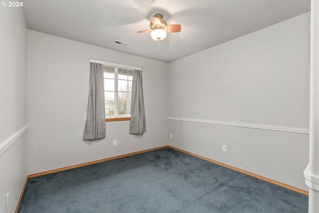 carpeted empty room with ceiling fan