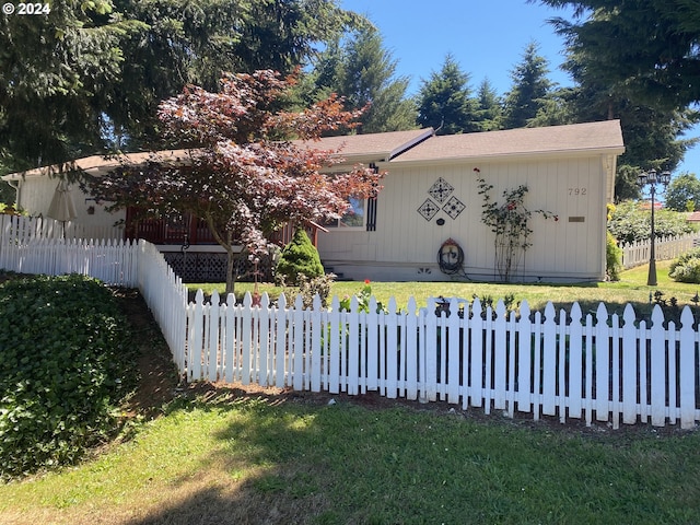 exterior space featuring a front lawn