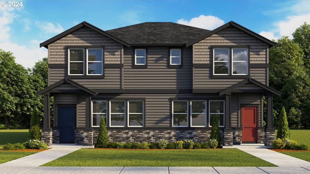 view of front of property with stone siding and a front lawn