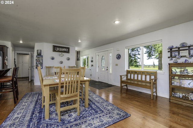 dining area with dark hardwood / wood-style floors