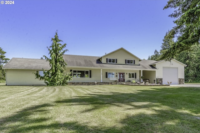 view of front of house featuring a garage and a front lawn