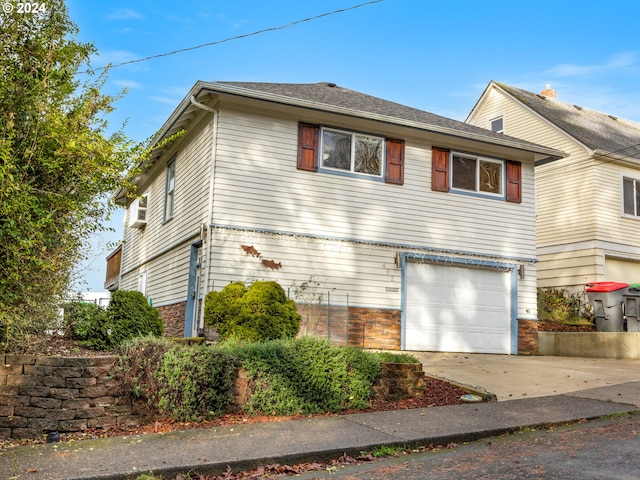 view of front of property with a garage