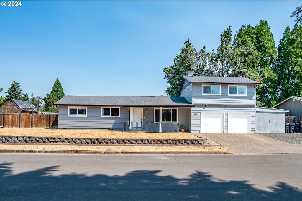 view of front of home with covered porch and a garage