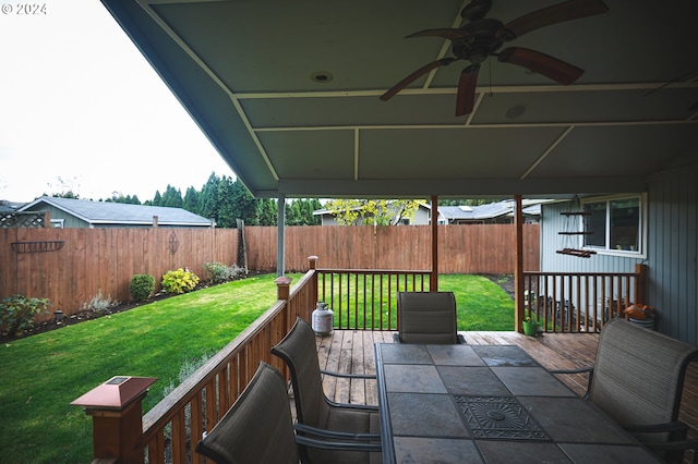 view of patio featuring ceiling fan and a wooden deck