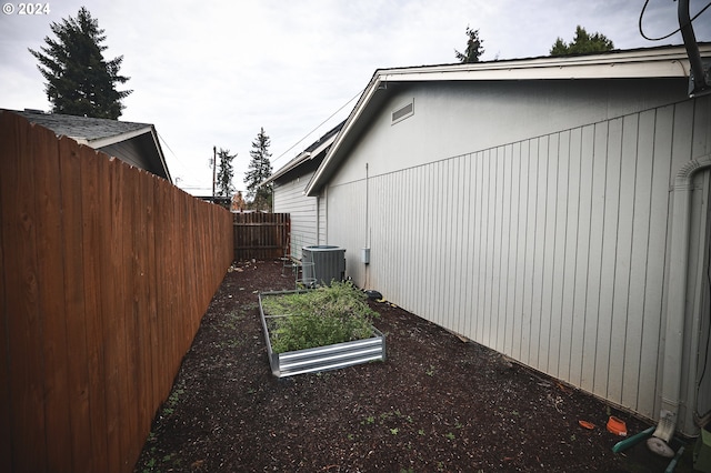 view of home's exterior with central air condition unit