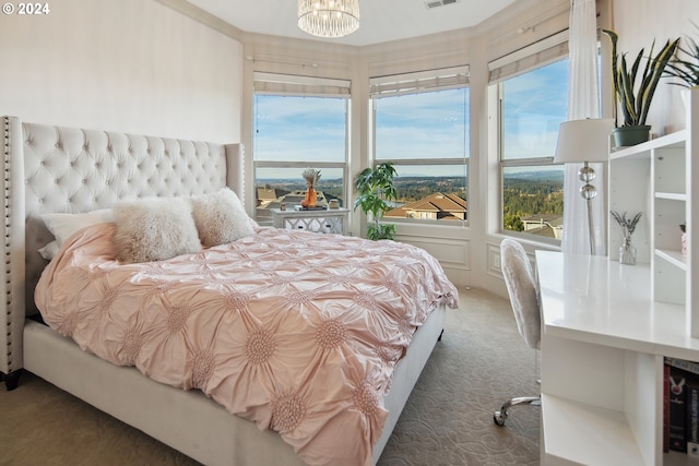 carpeted bedroom with a notable chandelier and wine cooler