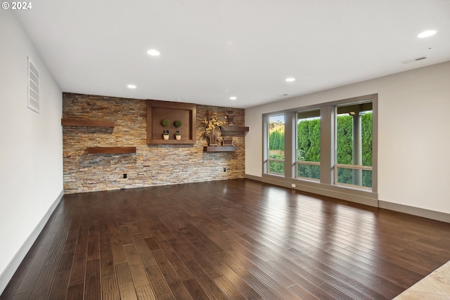 unfurnished living room featuring dark hardwood / wood-style flooring