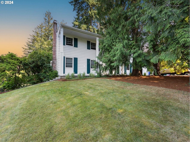 view of front of home with a yard