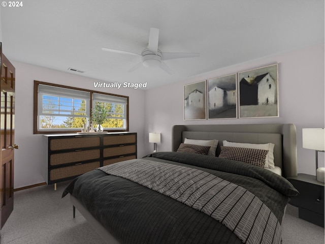 bedroom with light carpet and ceiling fan