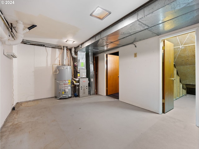 basement featuring heating unit and gas water heater