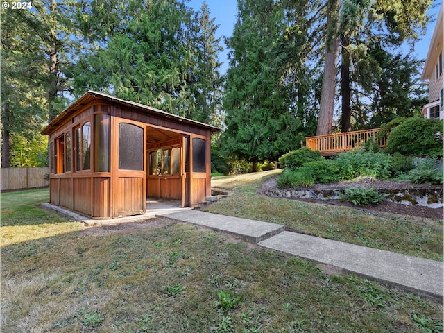 view of outdoor structure featuring a yard