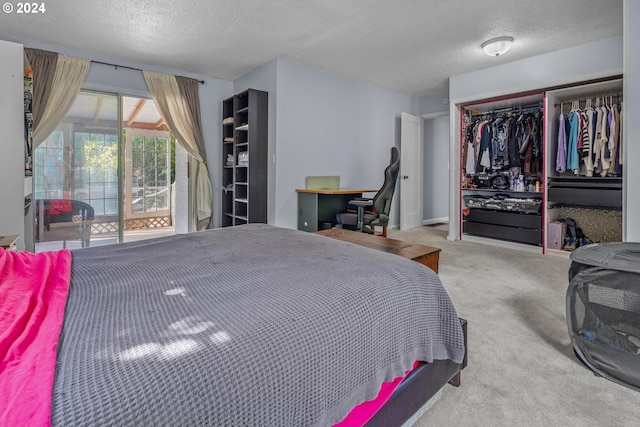 carpeted bedroom featuring access to outside and a textured ceiling