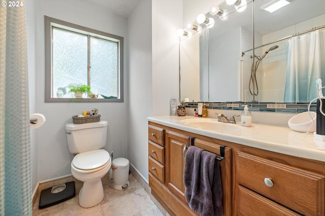 bathroom featuring tile patterned flooring, toilet, and vanity