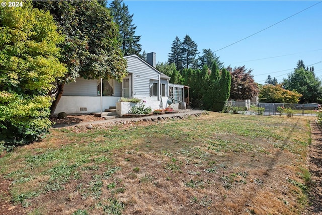 view of yard featuring a sunroom