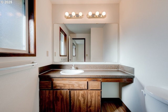 bathroom with vanity and toilet