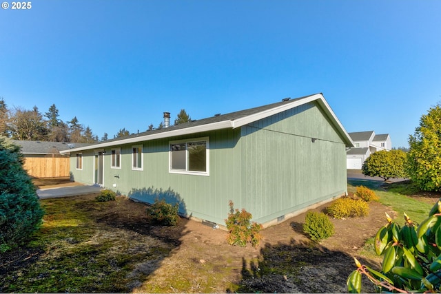 view of property exterior with a patio area