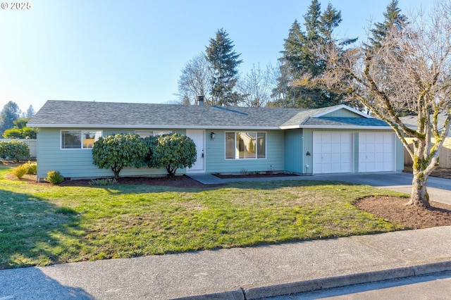 ranch-style house featuring a garage and a front yard