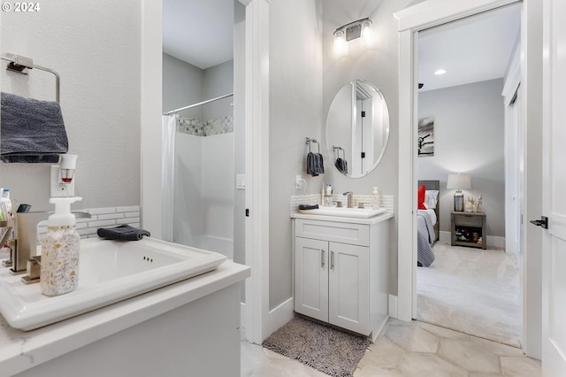 bathroom with vanity and walk in shower