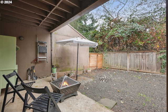 view of patio / terrace featuring a fire pit