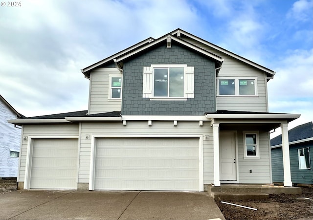 view of front facade featuring an attached garage and concrete driveway