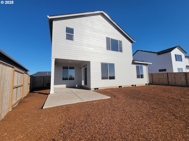 back of house with a patio area and a fenced backyard