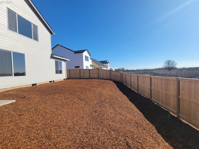 view of yard with a fenced backyard