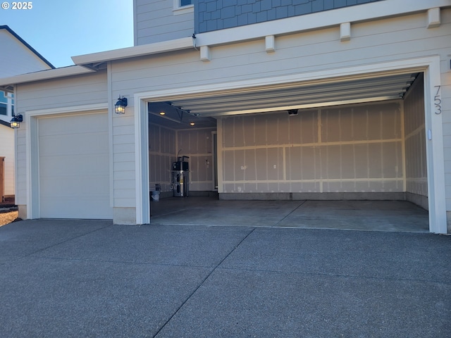 garage with concrete driveway