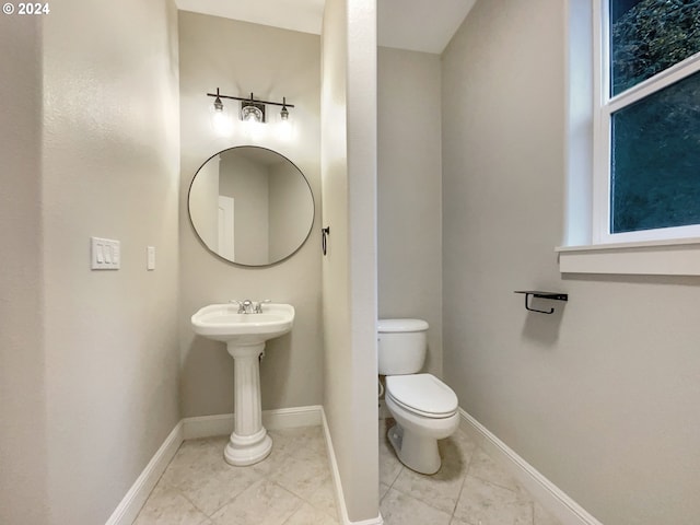 11574 SE Ross Rd, Happy Valley, OR 97086 - half bath with toilet, tile patterned flooring, and baseboards