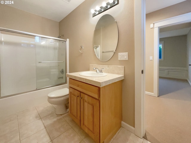11574 SE Ross Rd, Happy Valley, OR 97086 - full bathroom with tile patterned floors, shower / bath combination with glass door, vanity, and toilet