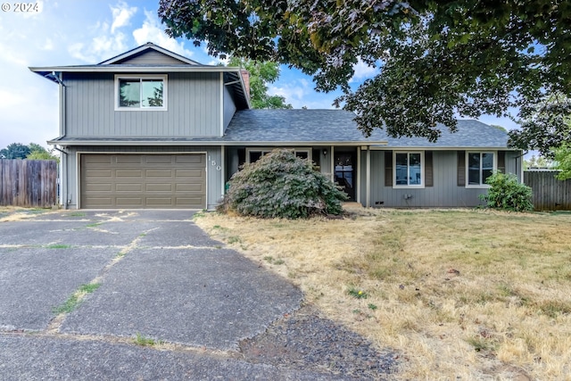 view of front facade with a garage and a front yard