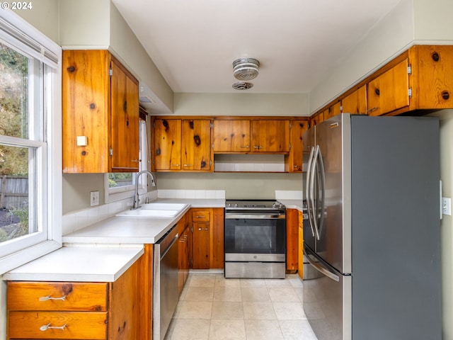 kitchen with sink and appliances with stainless steel finishes