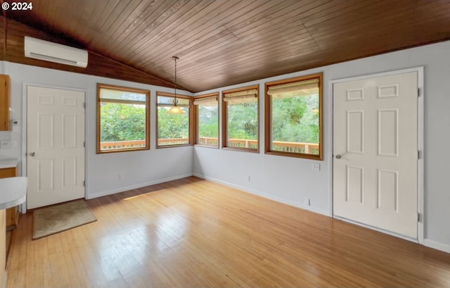 interior space with vaulted ceiling, a wall mounted AC, wooden ceiling, and light hardwood / wood-style floors