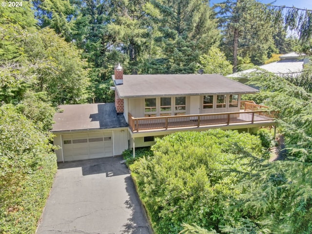 view of front of property featuring a wooden deck and a garage