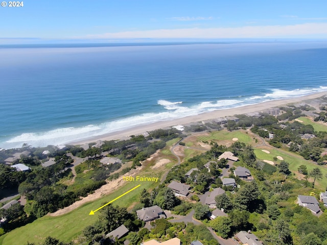 aerial view with a water view and a beach view