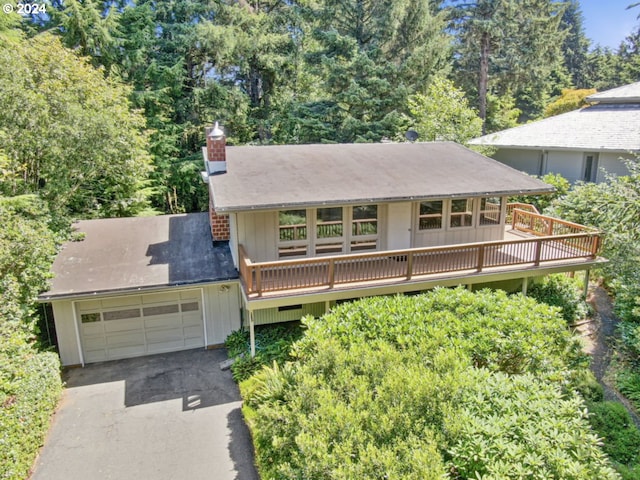 view of front of house with a garage and a deck