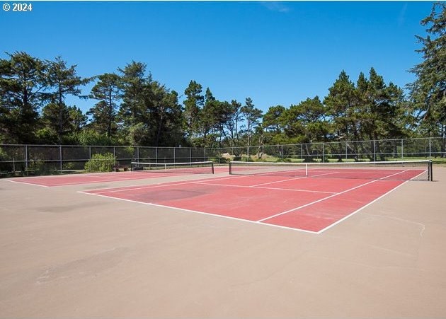 view of sport court featuring basketball hoop