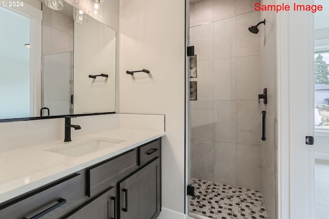 bathroom with vanity and walk in shower