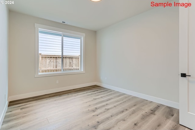 empty room featuring light hardwood / wood-style floors