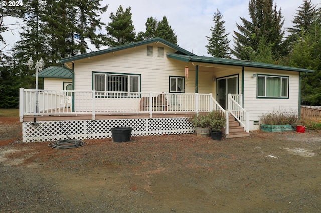 single story home with a wooden deck