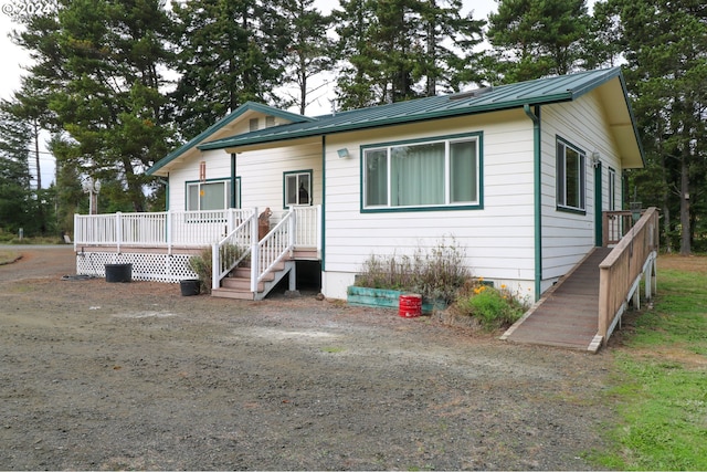 view of front of property featuring a wooden deck