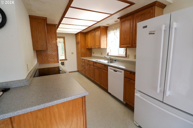 kitchen with white appliances and sink