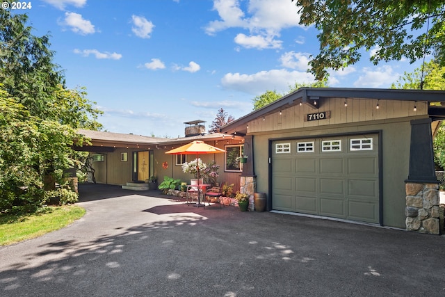 ranch-style home with a garage