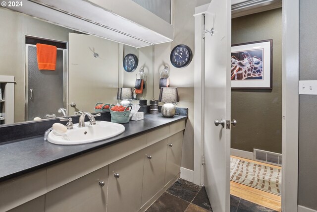 bathroom with vanity and tile patterned flooring