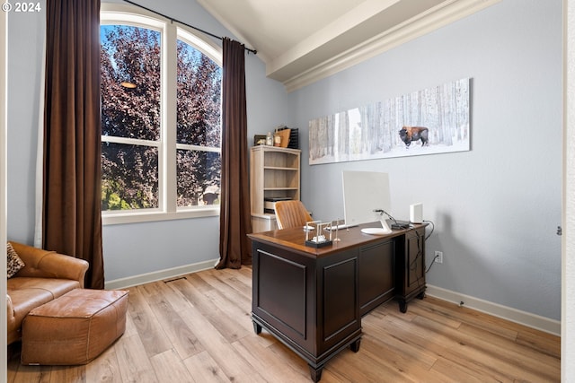 office area featuring light hardwood / wood-style flooring and vaulted ceiling