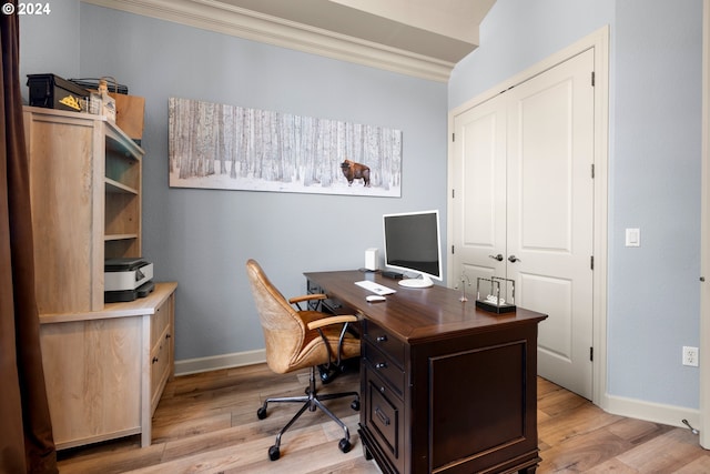 office with light wood-type flooring