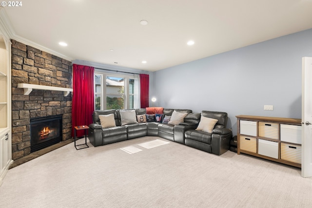 living room with a stone fireplace, light carpet, and ornamental molding