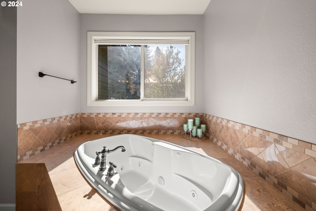 bathroom with tile walls and a bathing tub