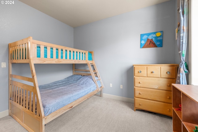 bedroom featuring light colored carpet