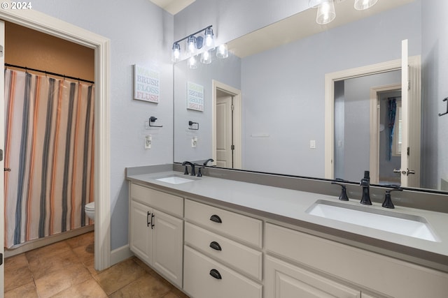 bathroom with toilet and vanity