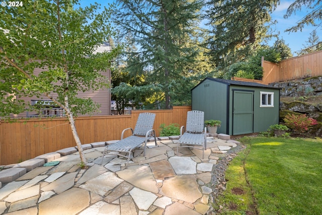 view of patio / terrace featuring a shed